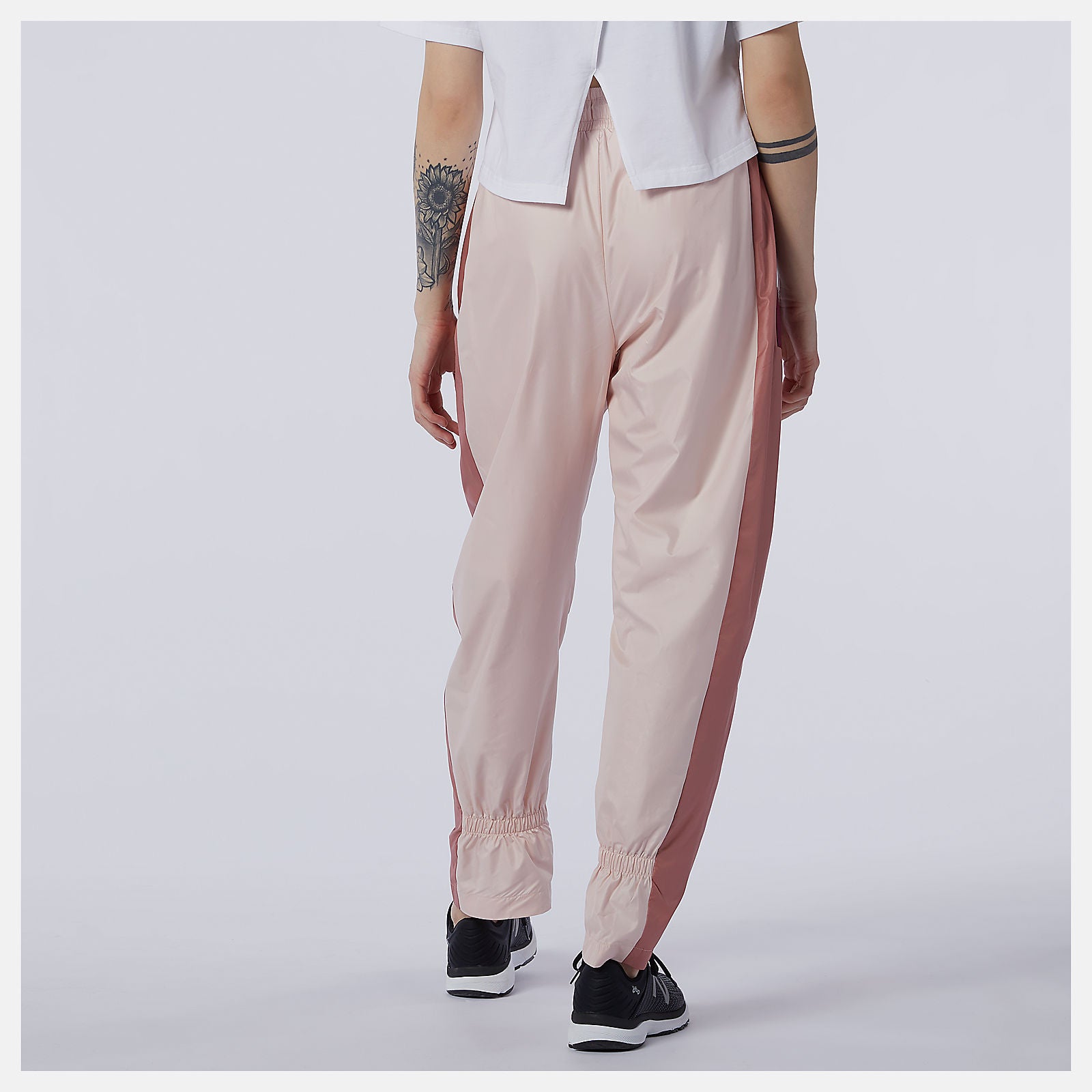NB Athletics Higher Learning Wind Pant | New Balance Clothing Oyster Pink - Women